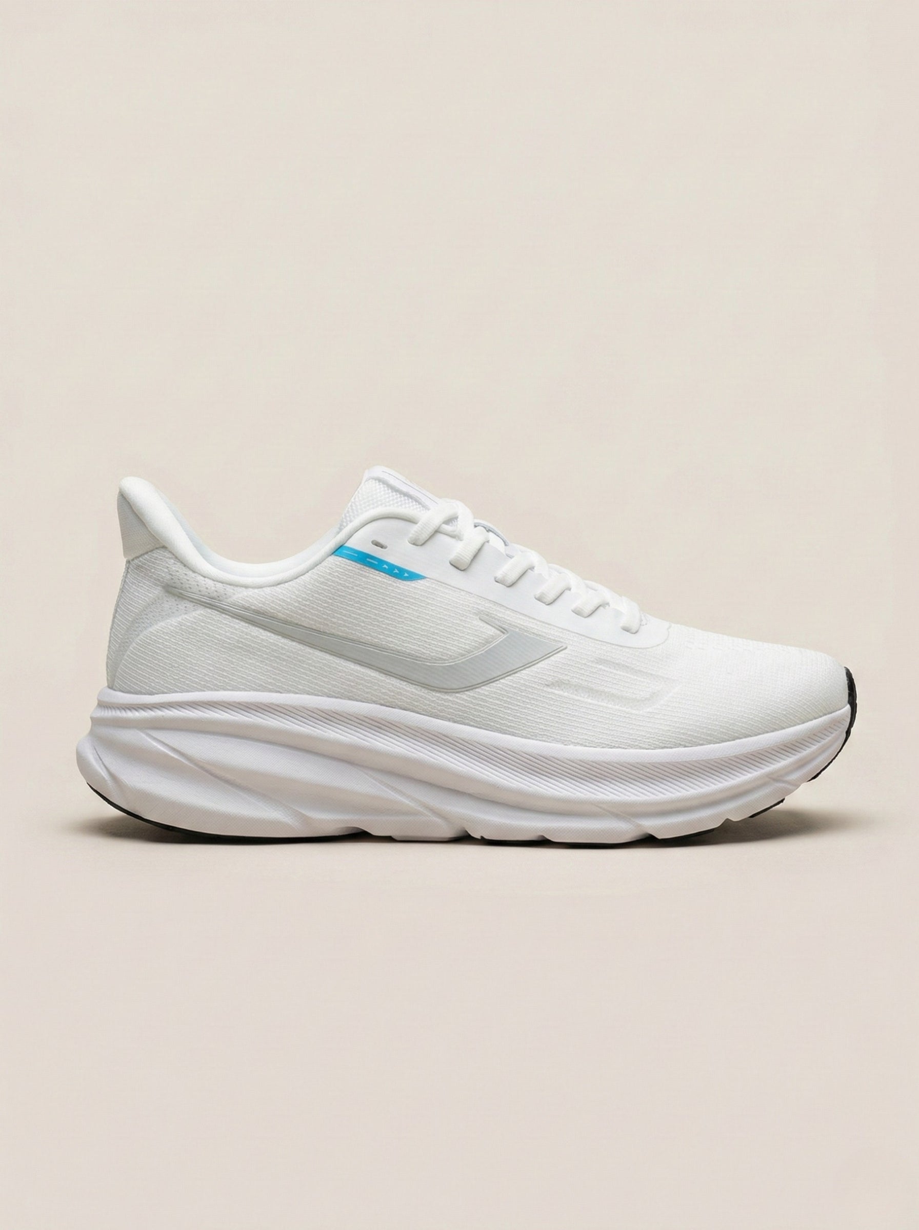 White running shoe on a beige background