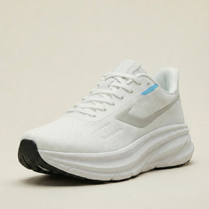 White running shoe on a beige background