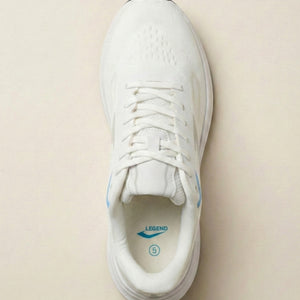 White sneaker with blue accents on a beige background